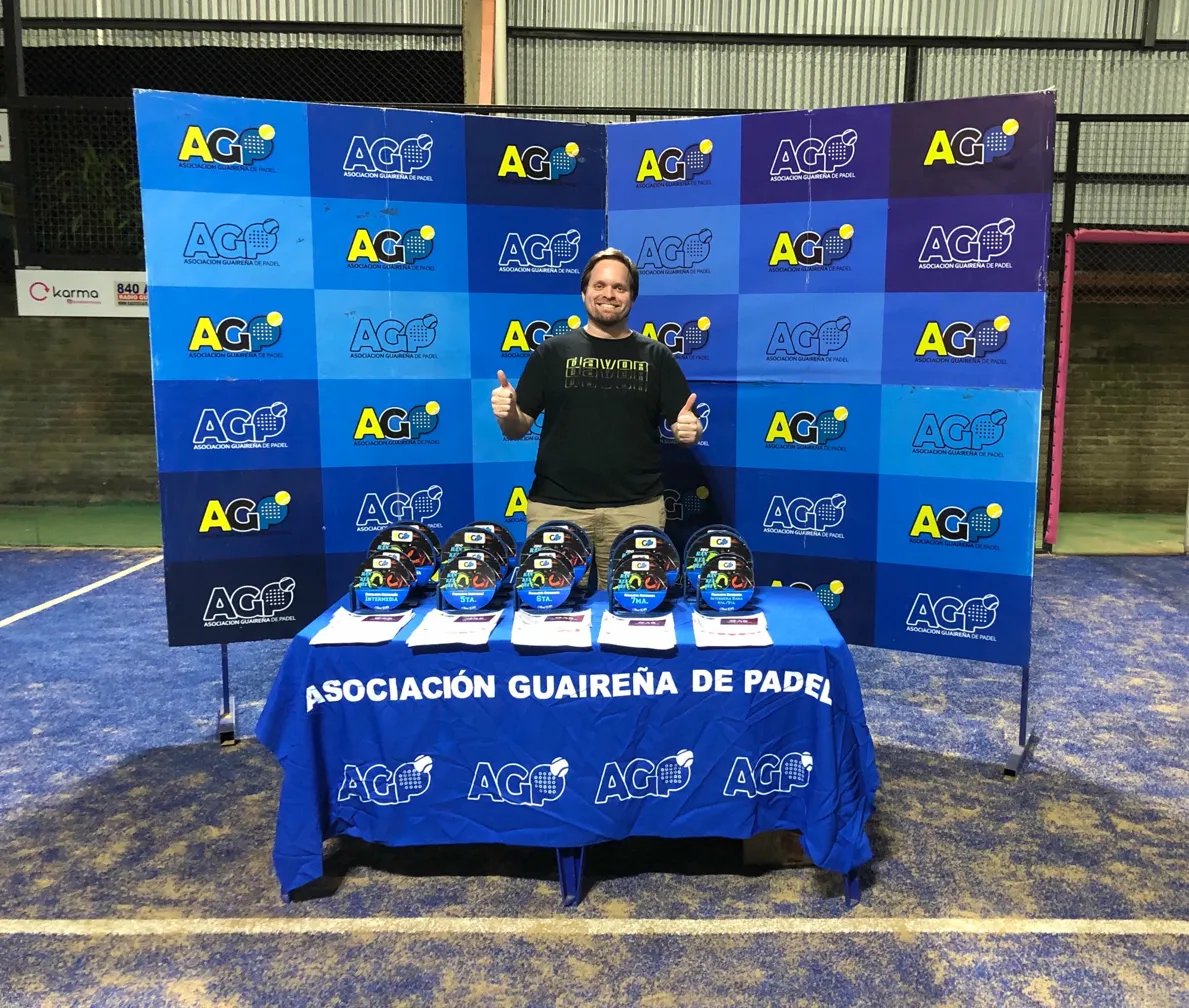 Christian Kaatz as AGP President with tournament trophies at the Asociación Guaireña de Padel