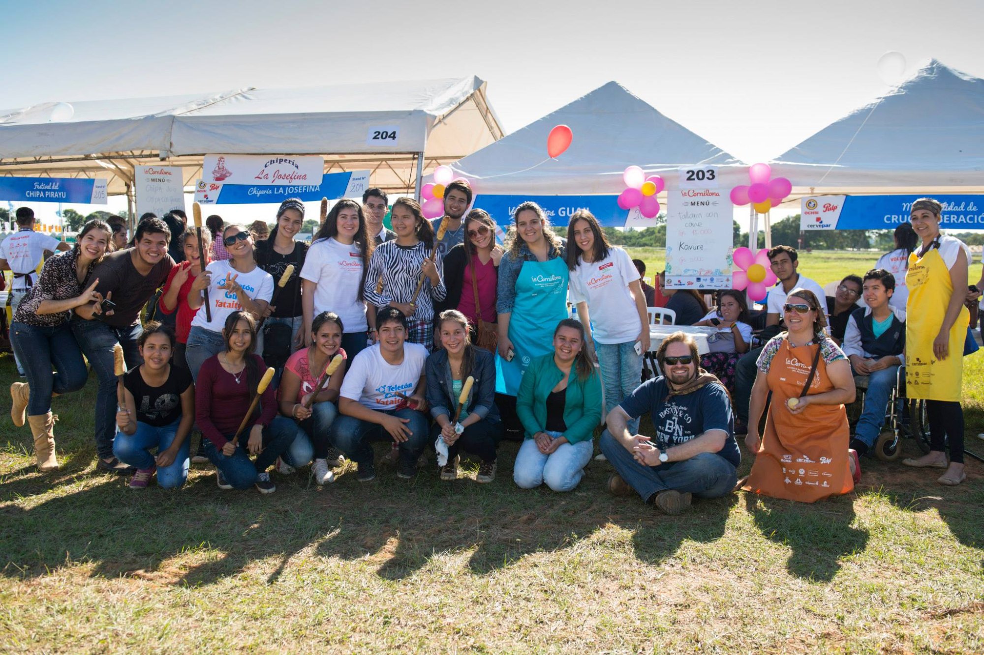 La Comilona fundraiser event — volunteer team at the food festival with Teletón branding