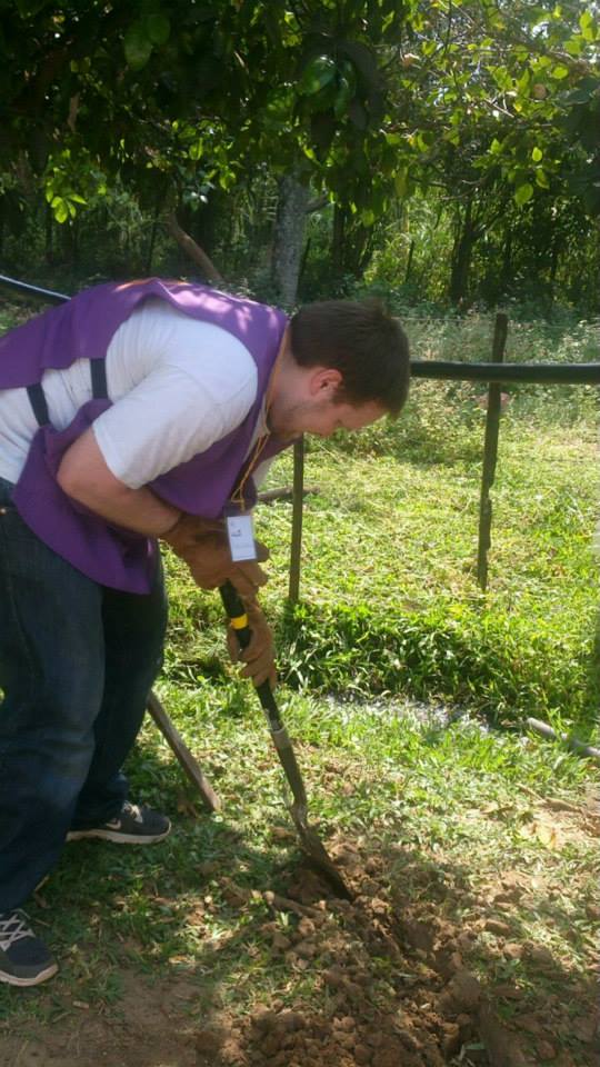 Christian digging foundations during a Teletón home improvement build
